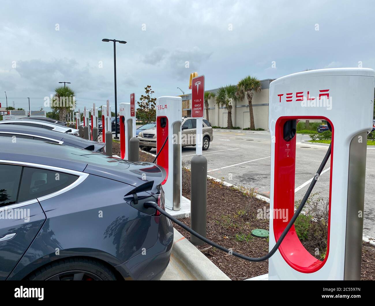Vero Beach, FL/USA6/6/20 Cars charging at a Tesla Supercharger Station in Florida Stock Photo