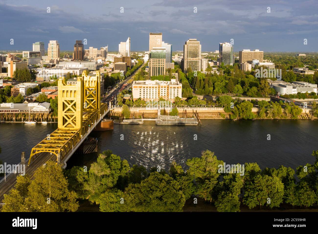 Late afternoon aerial of the Tower Bridge over the Sacramento River with the downtown skyline aerial Stock Photo