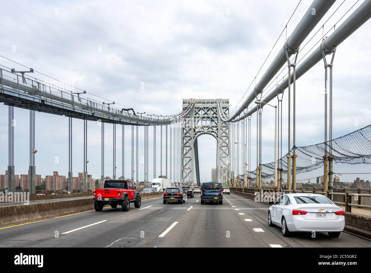 New York, USA, 28 June 2020. Vehicles drive through the upper deck of the Washington