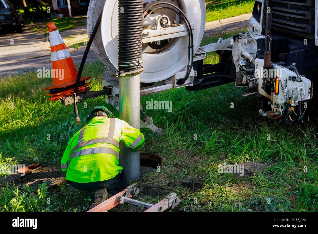 Cleaning the sewer system special equipment on utility service in the town. Stock Photo