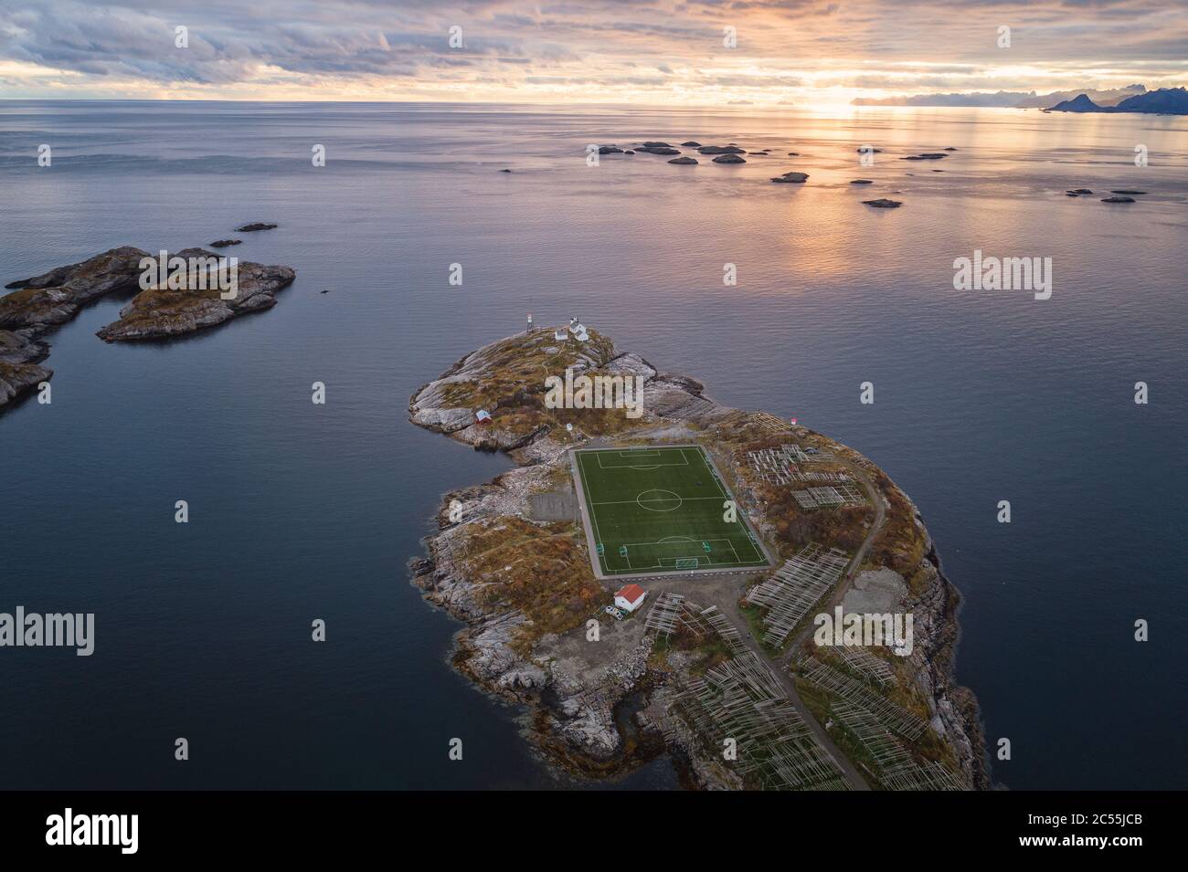 soccer field on the cliffs of HenningsvÃ¦r by the sea Stock Photo