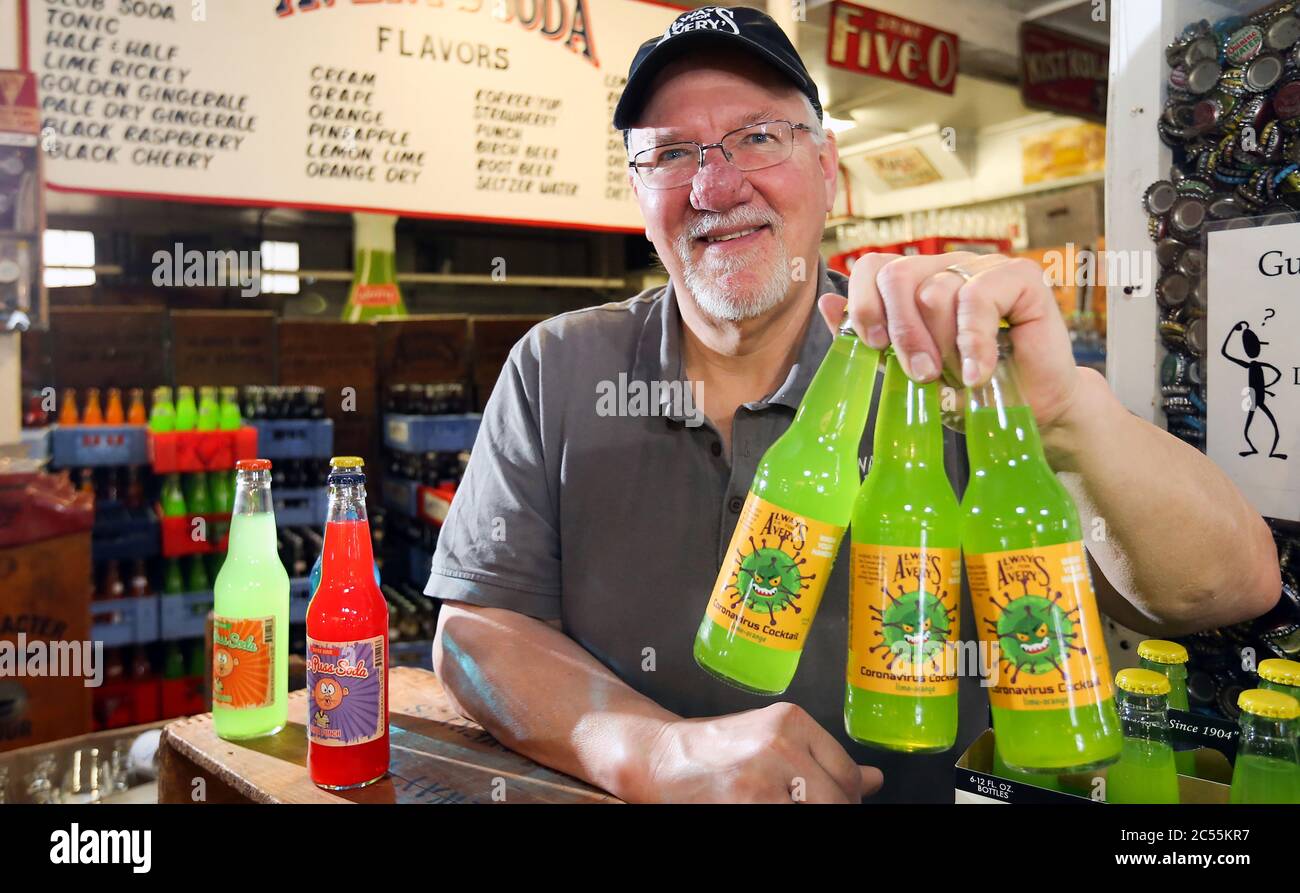 ROUND FOR THE HOUSE: March 13, 2020, New Britain, Connecticut, USA: General Manager ROB METZ holds bottles of Coronavirus Cocktail, a limited edition lime-orange specialty soda produced by Avery's Beverages. Avery's has been in business since 1904, and makes soda in more than 35 flavors. They also produce a line of ''Totally Gross Sodas'' like Bug Barf, Toxic Slime, Monster Mucus and Zombie Brain Juice. Avery also makes limited edition sodas relating to things in the news. Past hits include So Long Osama, Deflated Ball Brew relating to the National Football League, and more recently Peach-Min Stock Photo