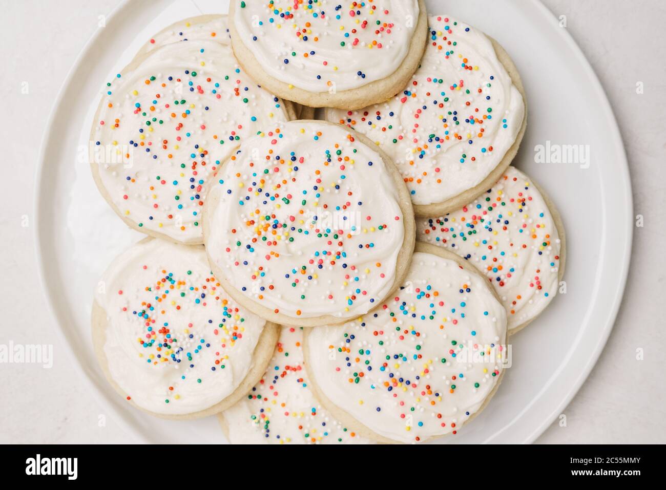 Sugar cookies decorated with rainbow sprinkles Stock Photo Alamy