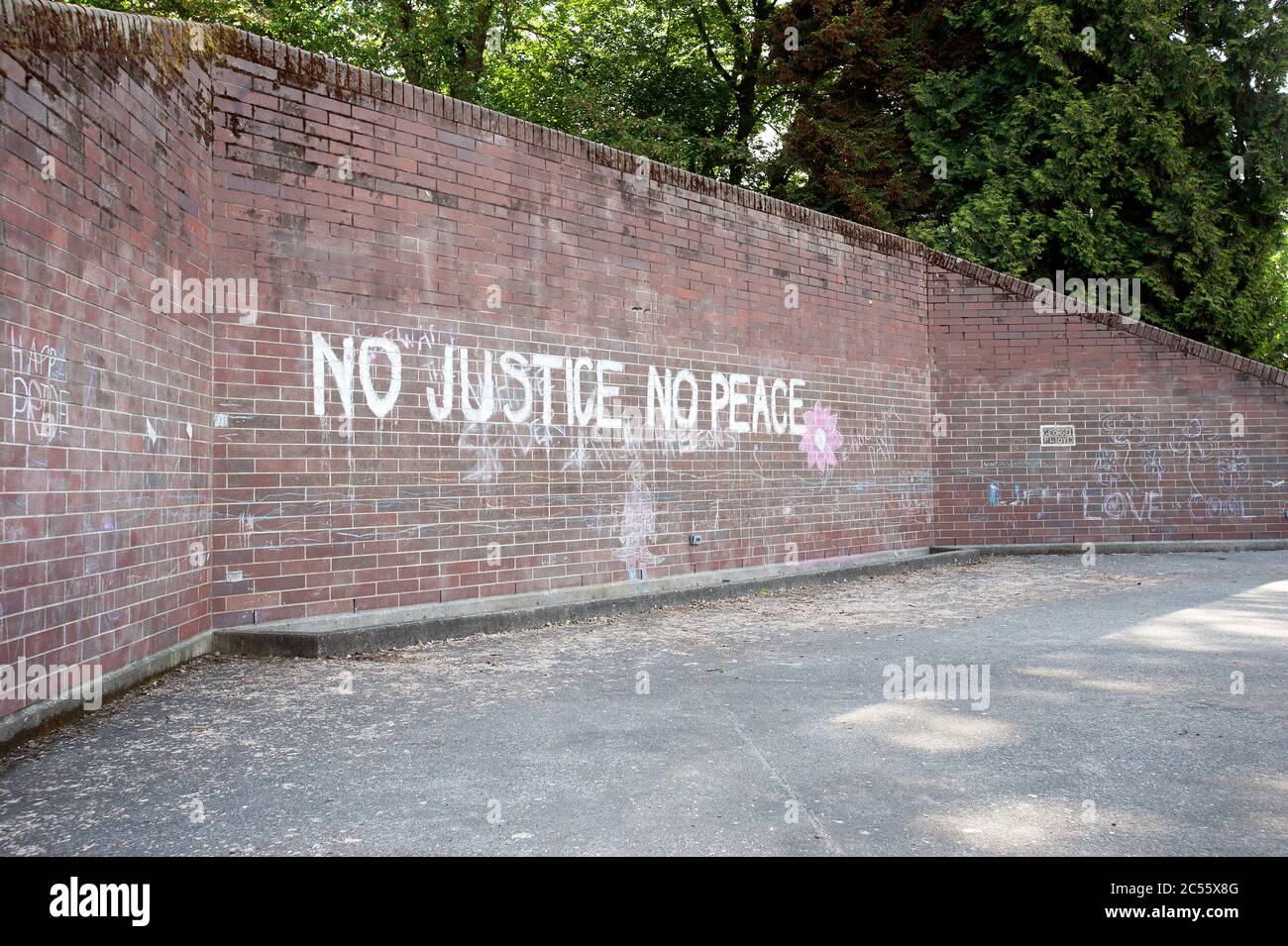Seattle, Washington State, USA. ‘No Justice No Peace’ writing on wall. Stock Photo