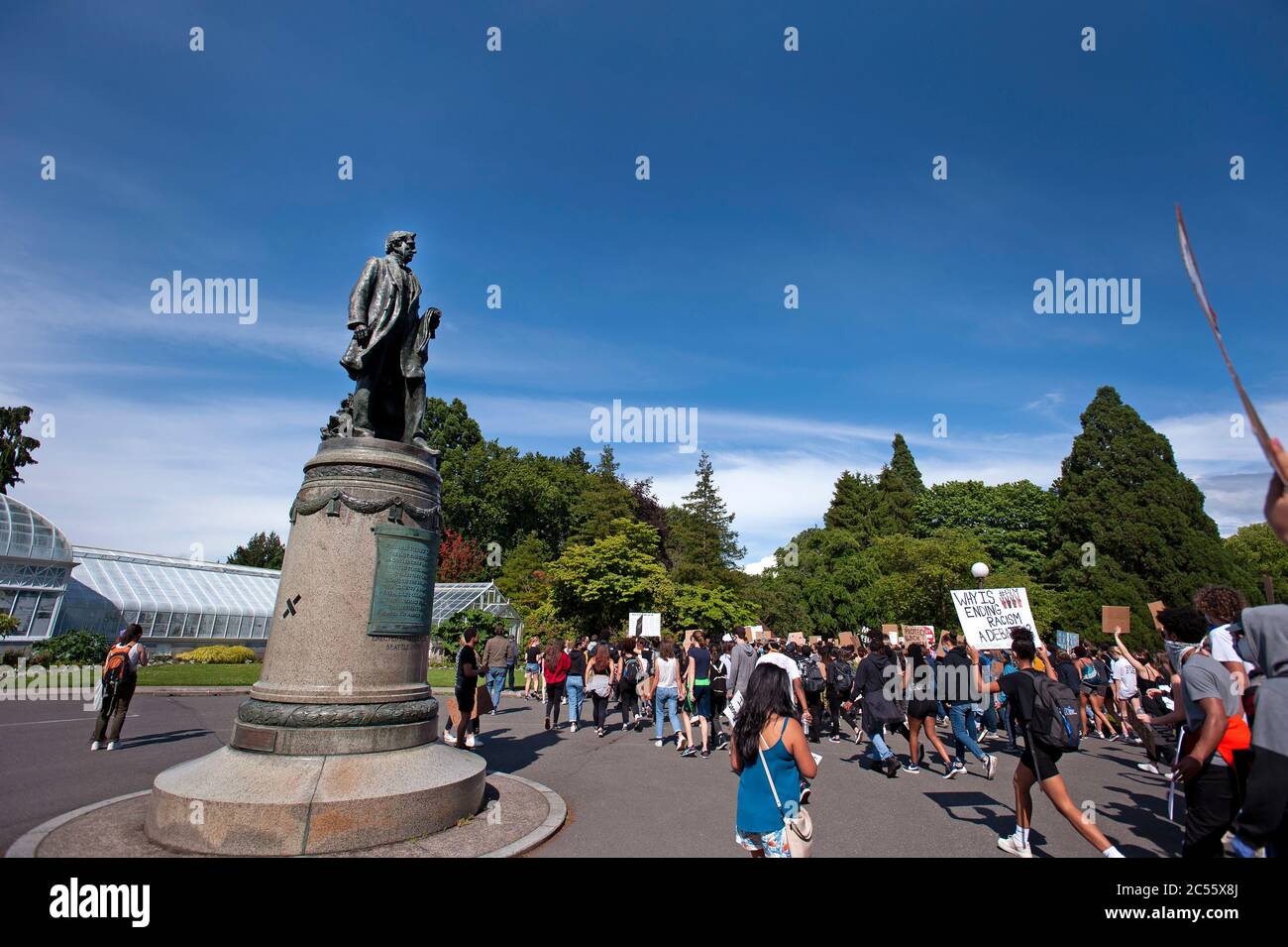 William Henry Seward statue looks on as a student-led march passes. Stock Photo
