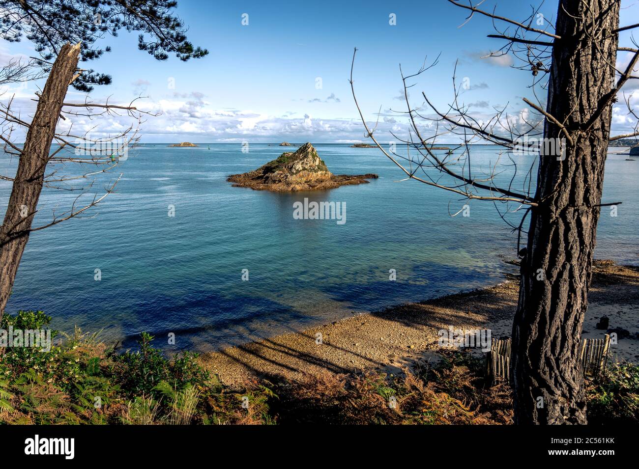 Beautiful view of the shore and a small island on the sea in Carantec, Bretagne, France Stock Photo