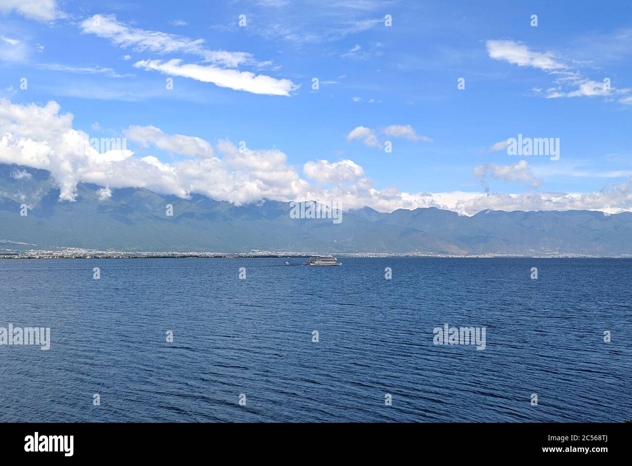 landscape of blue lake and blue sky with white clouds Stock Photo - Alamy