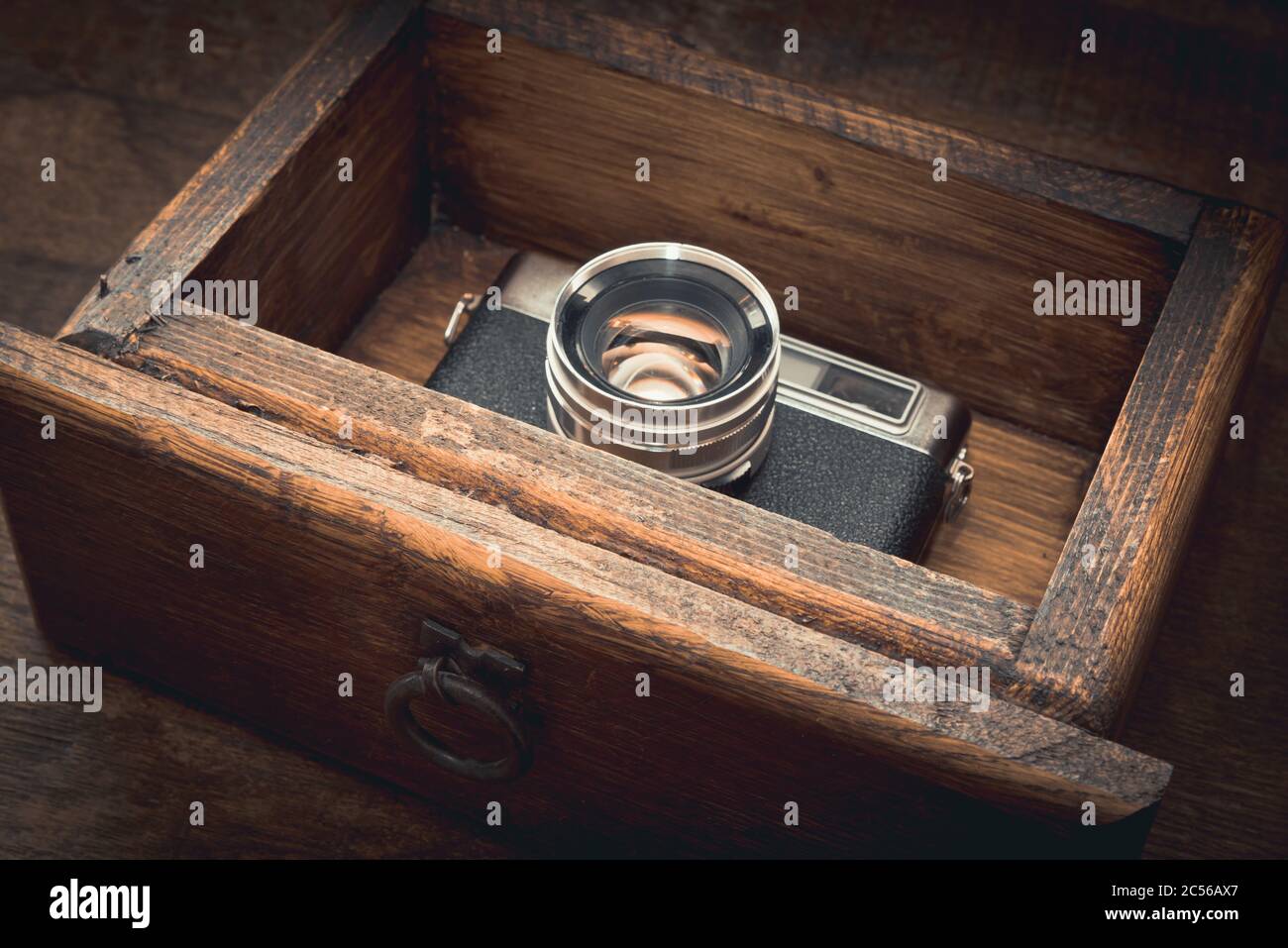 High angle closeup shot of a vintage camera in a locker under the light ...