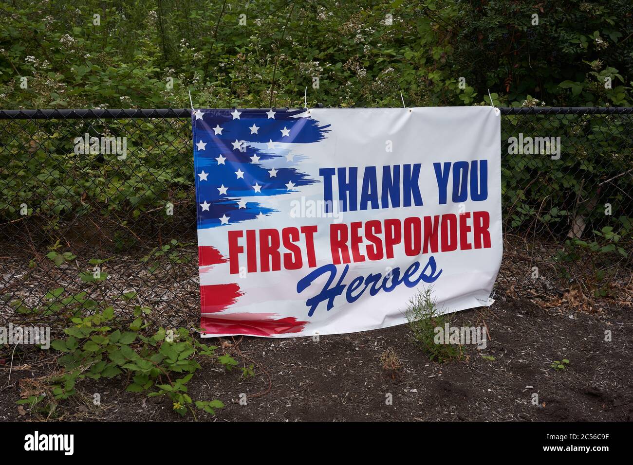 A banner with a message of gratitude for first responders is seen outside the Lake Oswego High School campus during the coronavirus pandemic. Stock Photo