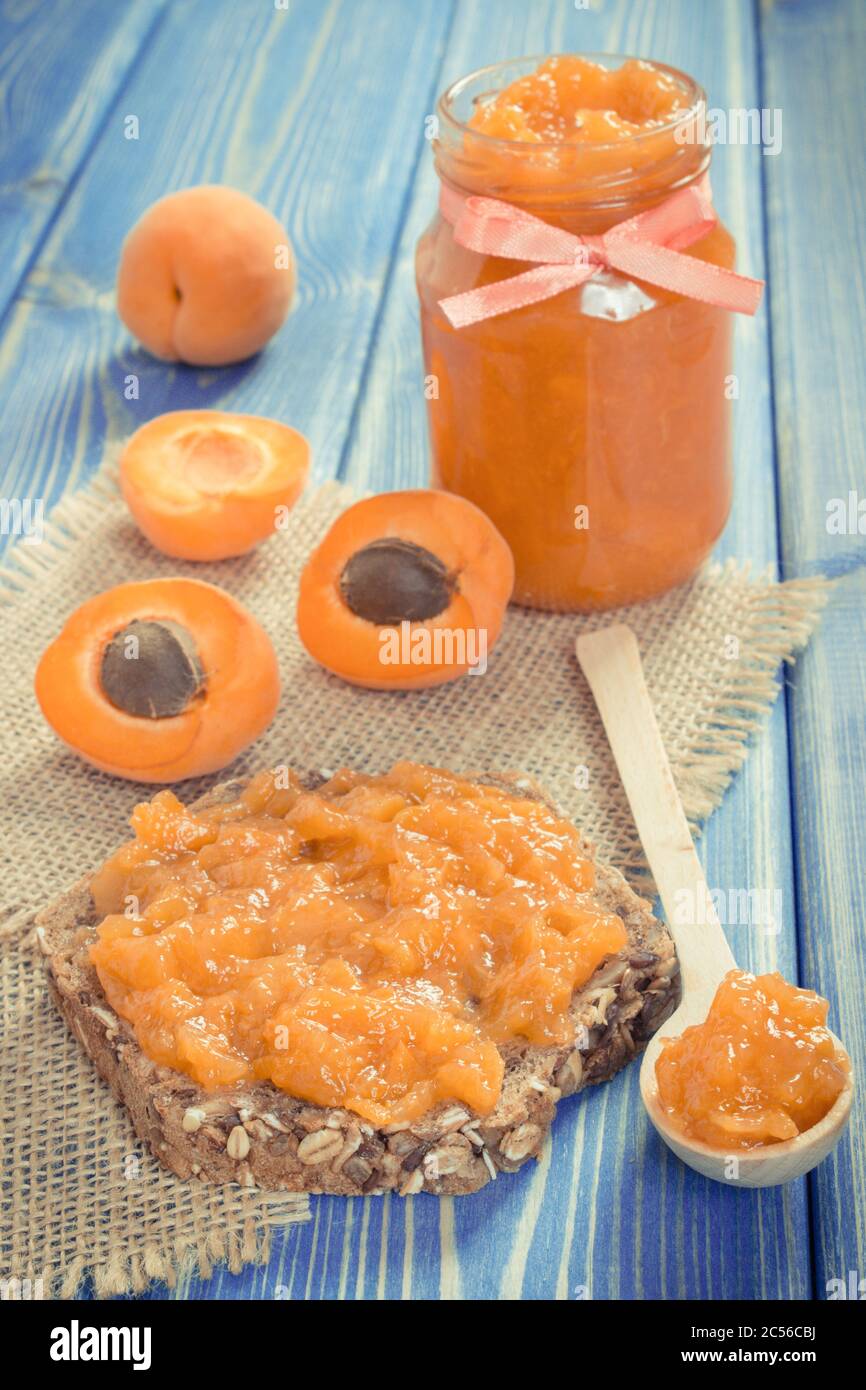 Sandwich with apricot jam or marmalade and ripe fruits, concept of healthy sweet dessert Stock Photo