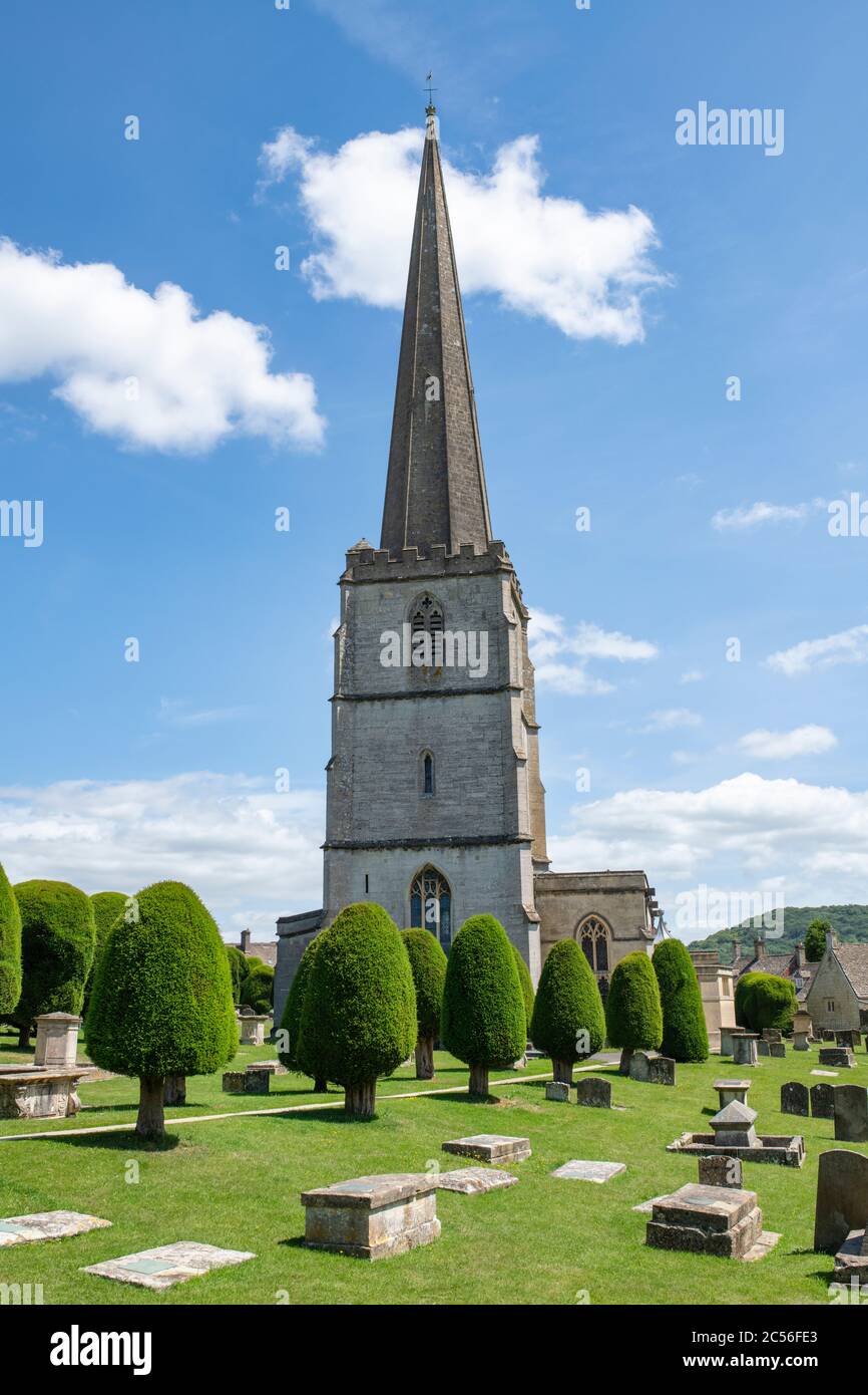St Marys church and yew trees in the sunlight. Painswick, Gloucestershire, England Stock Photo