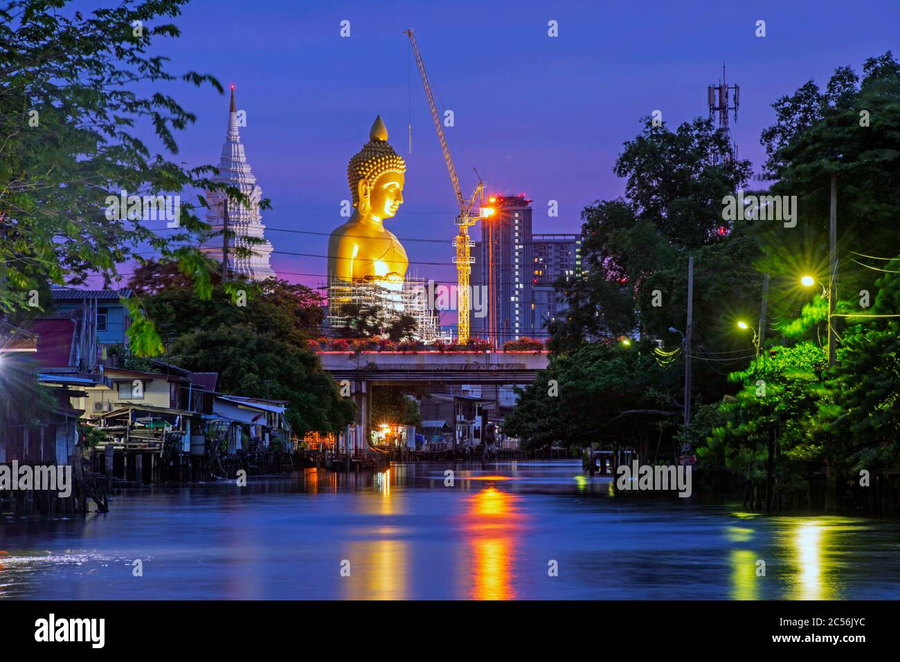 A new Buddha appears on the Bangkok skyline. The statue, called ‘Dhammakaya Thep Mongkol Buddha’ at Paknam Bhasicharoen Temple, is made of copper, and Stock Photo