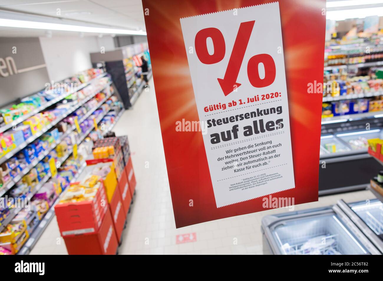 Cologne, Germany. 01st July, 2020. A poster saying 'Tax reduction for all' is hanging in a Penny Market. From 01.07.2020, only 16 instead of 19 percent VAT will be charged for half a year when shopping, the reduced rate will drop from 7 to 5 percent. With this, the German government wants to boost consumption again after the Corona crisis. Credit: Rolf Vennenbernd/dpa/Alamy Live News Stock Photo
