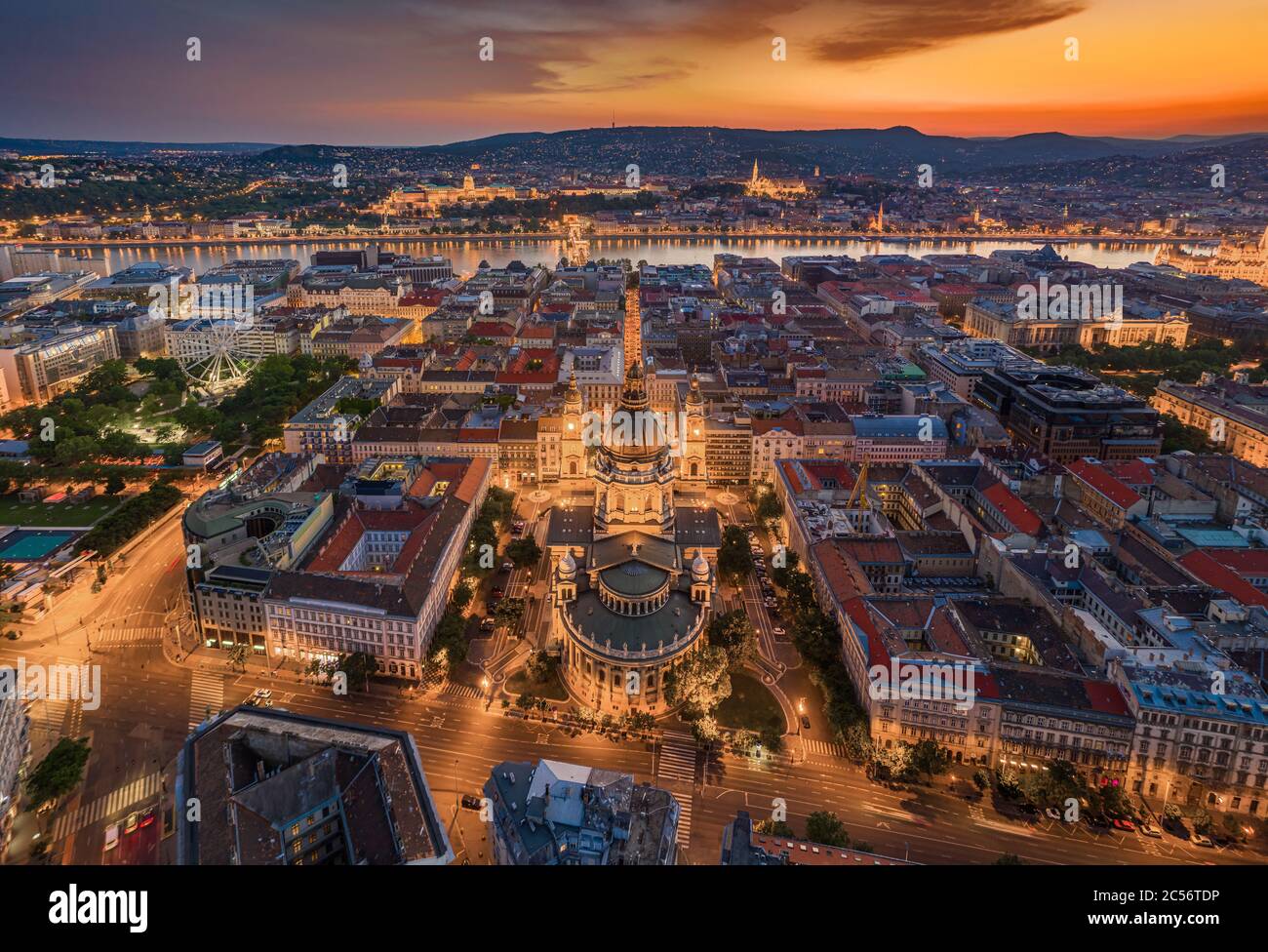 Budapest, Hungary - Aerial panoramic view of illuminated Budapest with a magnificent golden sunset. The view includes St.Stephen's Basilica, Szechenyi Stock Photo