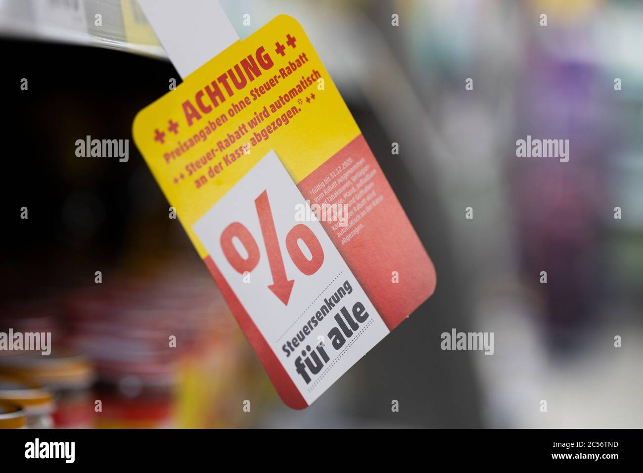 Cologne, Germany. 01st July, 2020. "Tax cuts for all" is written on a shelf  in a penny market. From 01.07.2020, only 16 instead of 19 percent VAT will  be charged for half