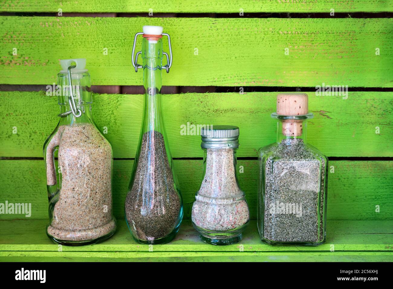 sea sand in glass bottles, souvenirs from summer holidays Stock Photo