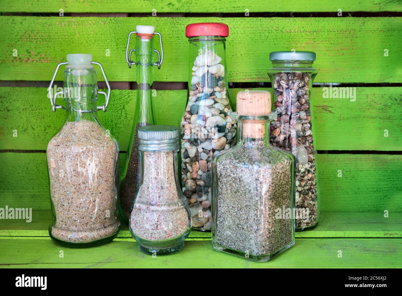 sea sand in glass bottles, souvenirs from summer holidays Stock Photo
