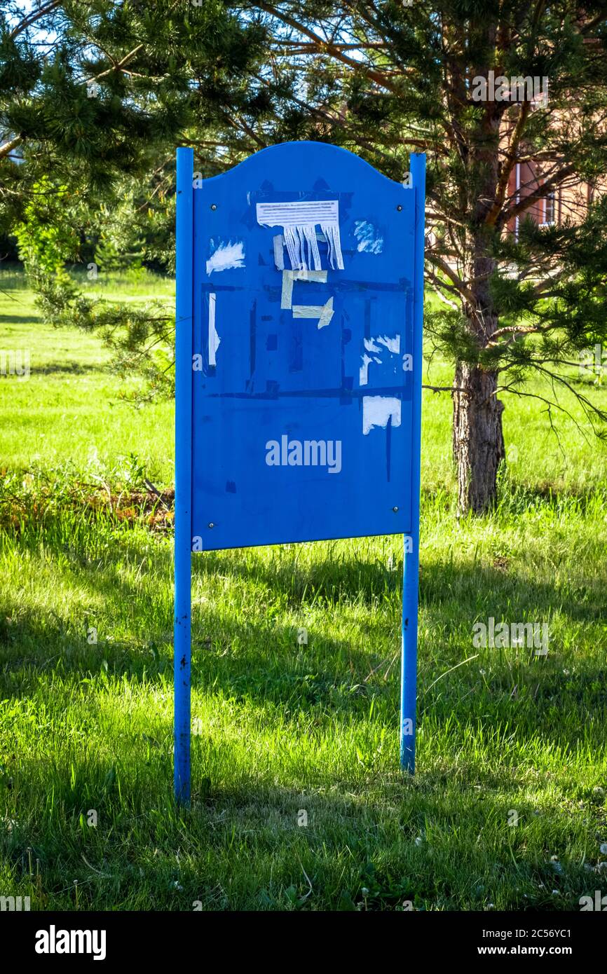 Blue metal message board on the street Stock Photo Alamy