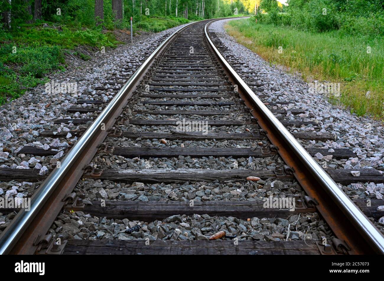 low perspective of rail tracks into a bend Stock Photo Alamy