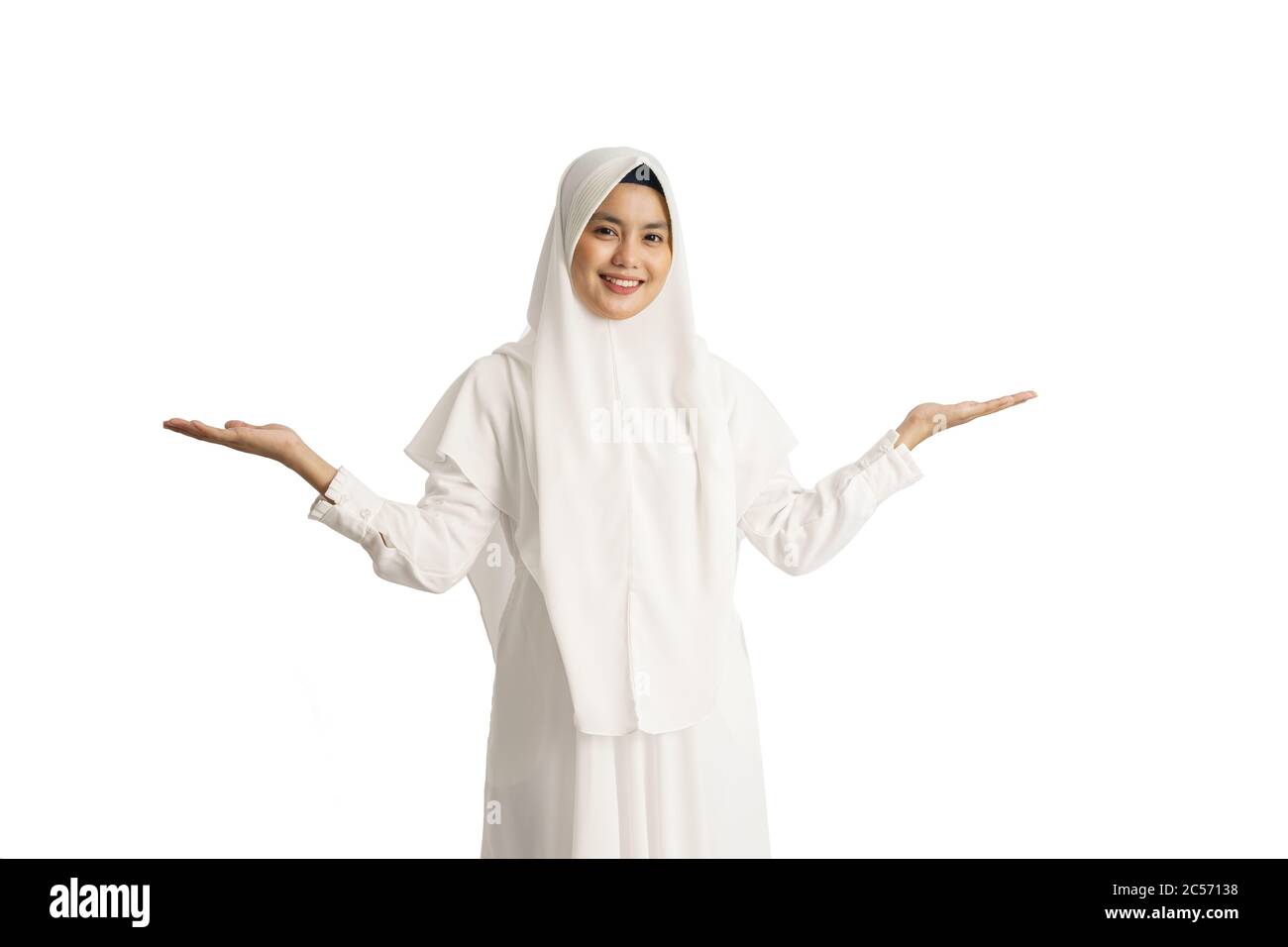 muslim beautiful asian woman with white hijab presenting smiling to ...