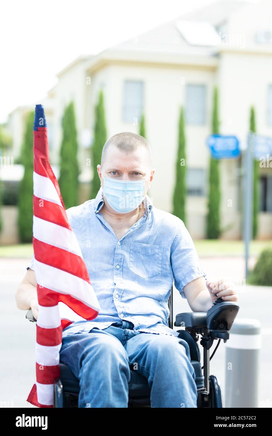 American freedom in wheelchair. USA flag Stock Photo