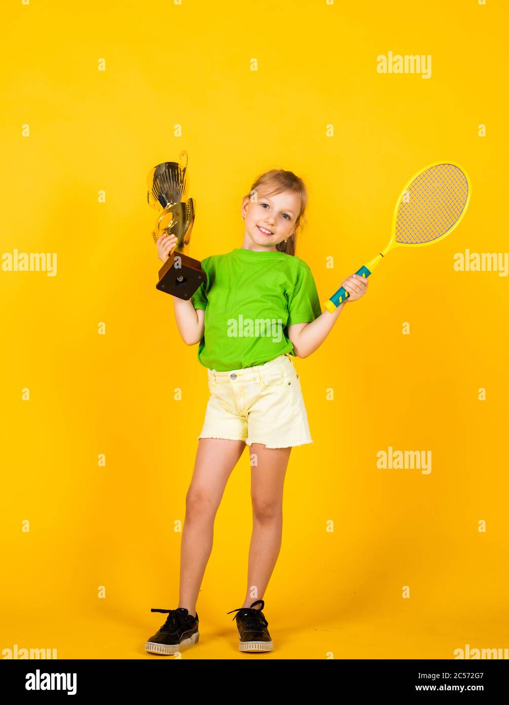 Sport is life. small girl hold championship cup and tennis racket. badminton  game champion. Victory and win. Sport achievement. sport success concept.  happy childrens day. happy childhood Stock Photo - Alamy