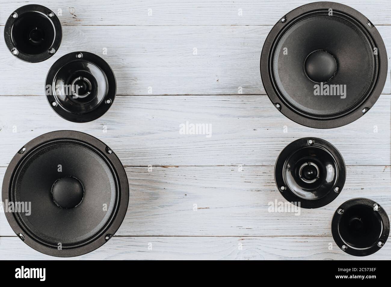 Car audio, car speakers on a white wooden background. Copy space Stock Photo