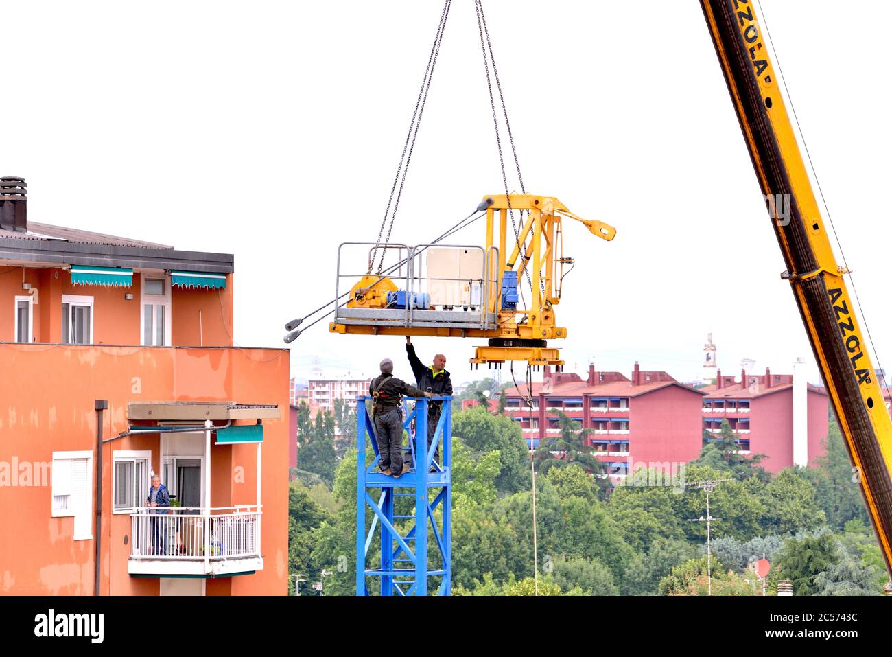 Tower crane builders hook the top, suspended in the void Stock Photo