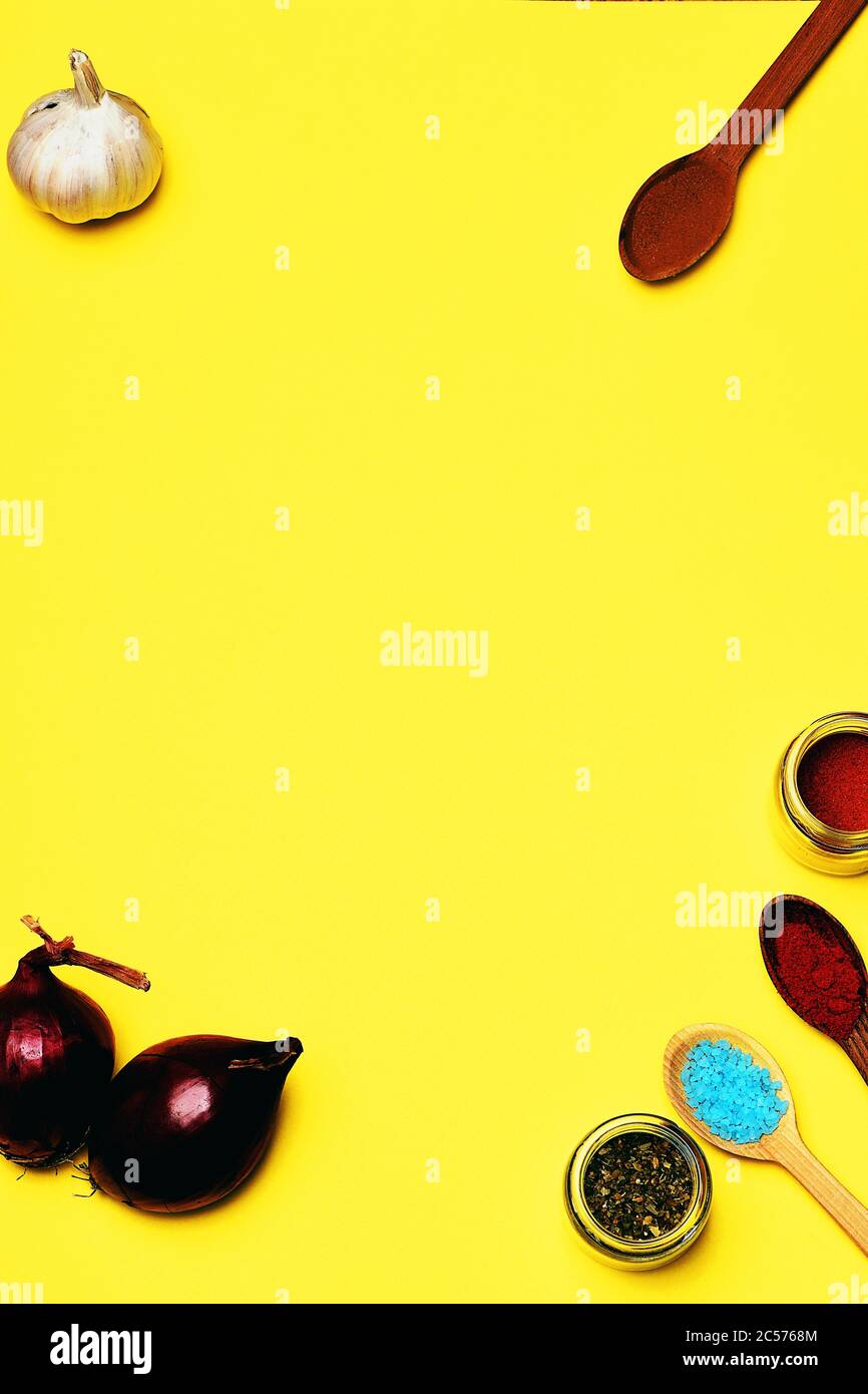 Download Set Of Colorful Spices With Salt Cinnamon Jar Paprika Garlic Onion On Yellow Background Copy Space Stock Photo Alamy PSD Mockup Templates