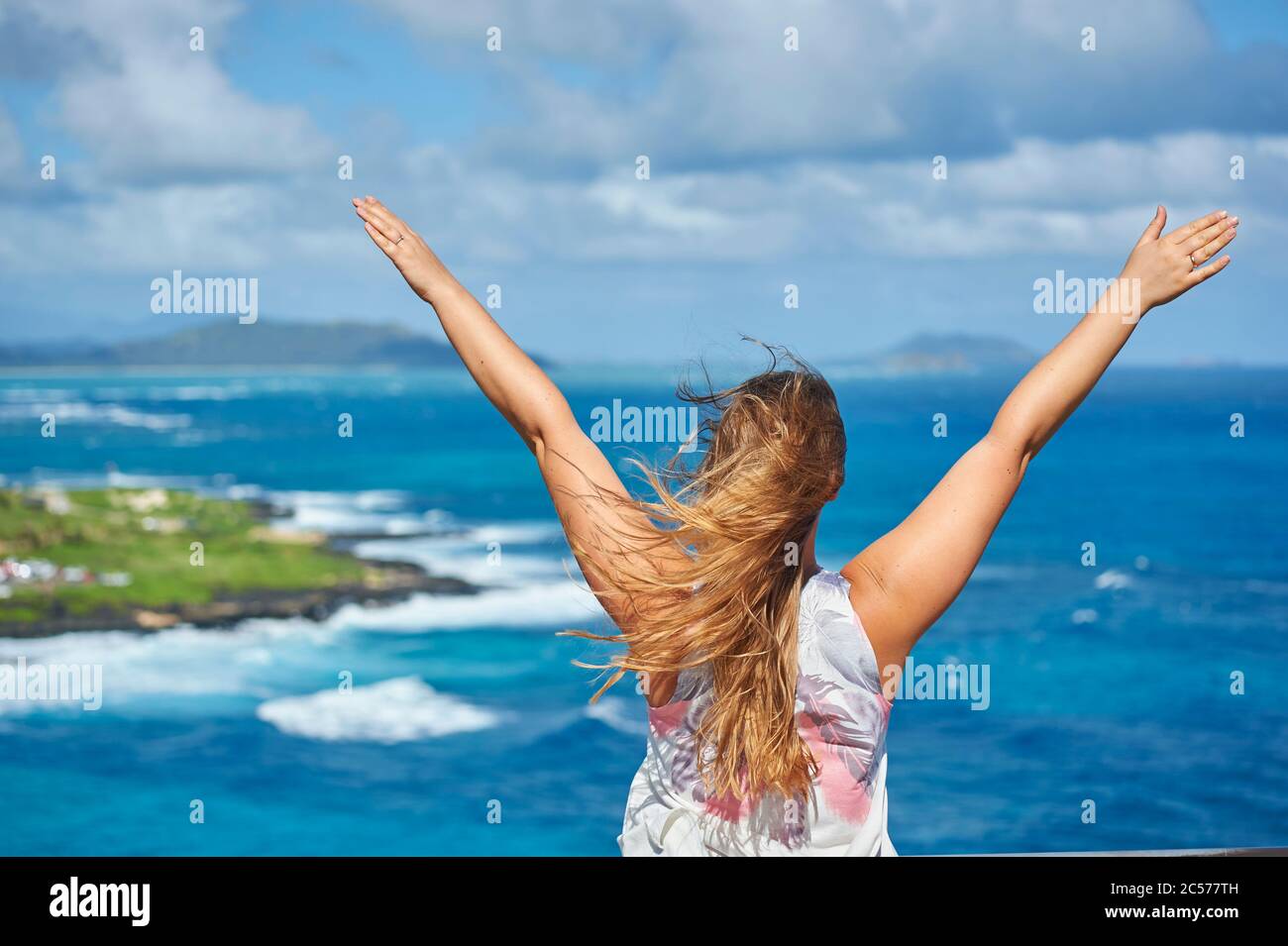 Young woman enjoys the view from Makapu'u Lookout, North Coast, Hawaiian Island of Oahu, Oahu, Hawaii, Aloha State, USA Stock Photo