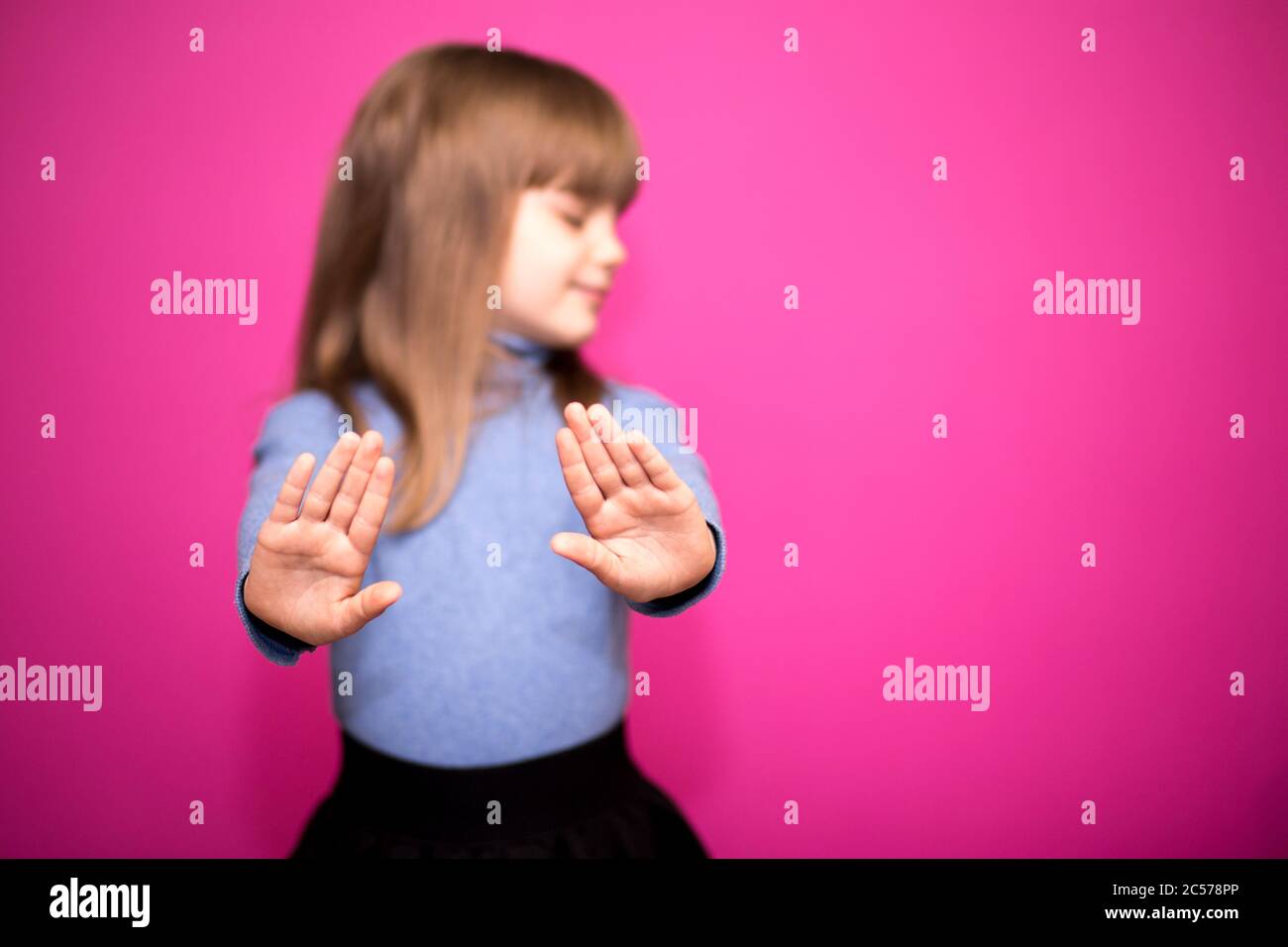 8-year-old girl, hands up showing her palms Stock Photo - Alamy