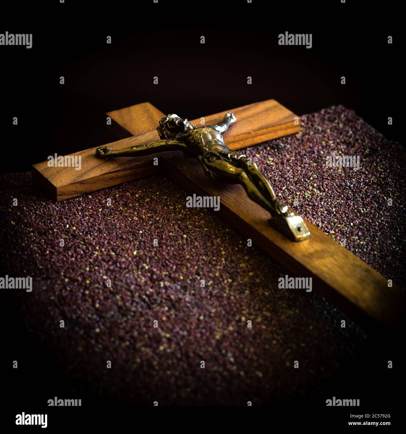 Closeup shot of a Crucifix on the table Stock Photo