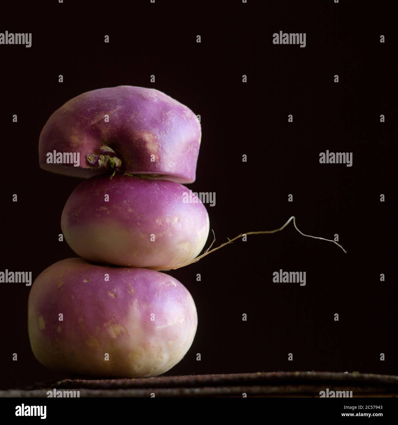 Closeup shot of turnips on a black background Stock Photo