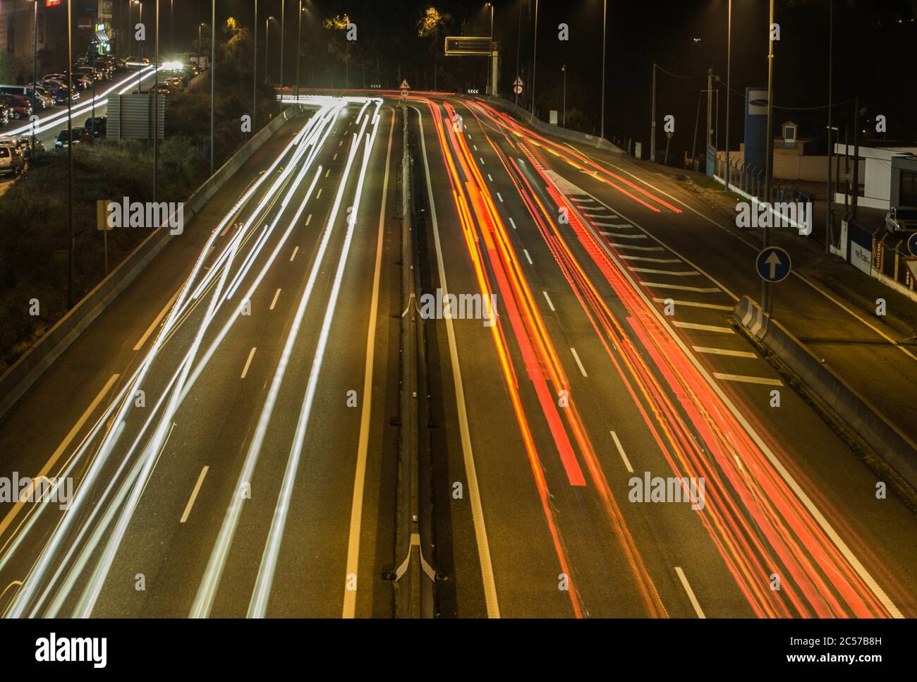 Light trails along the highway at night Stock Photo - Alamy