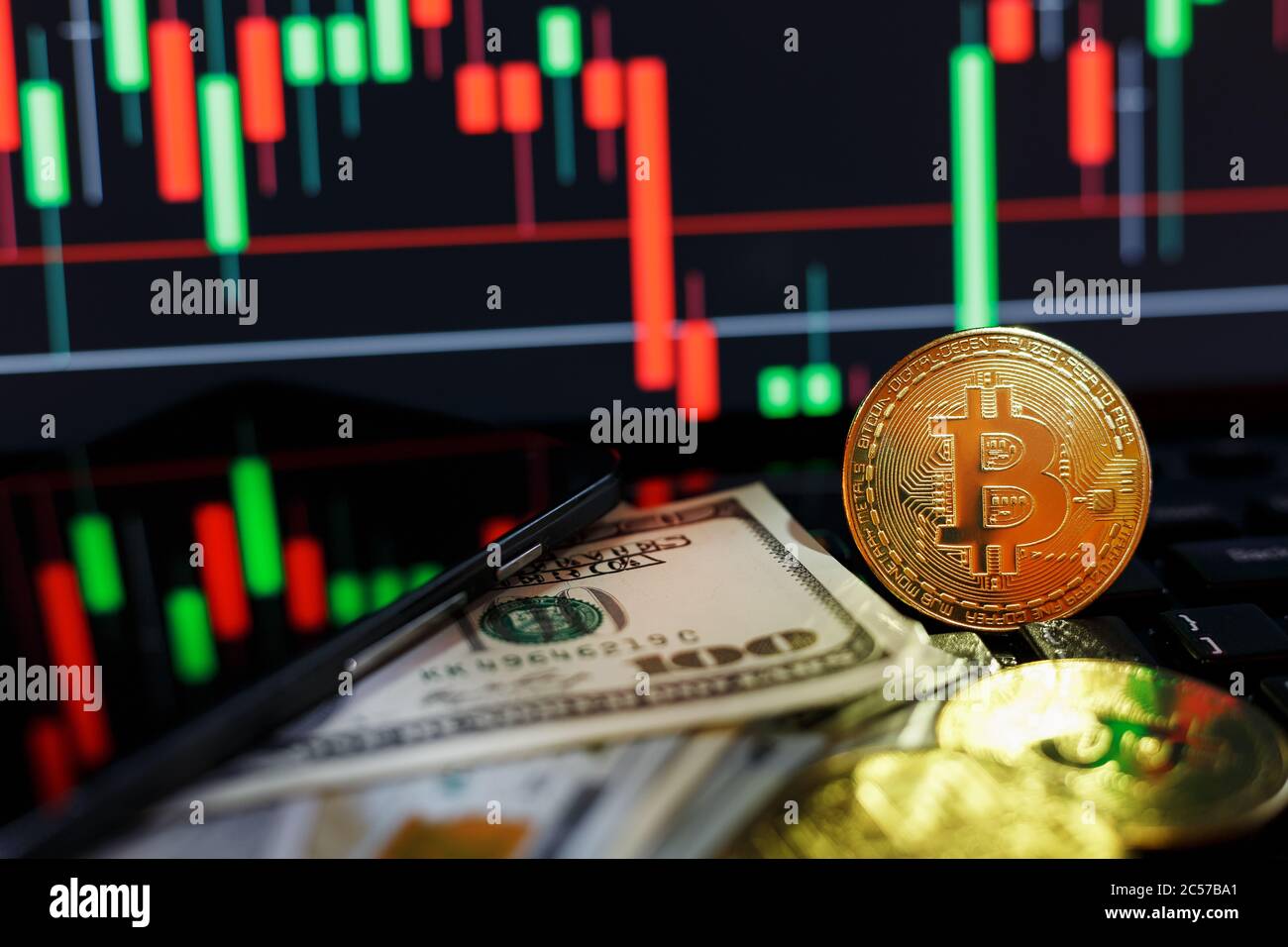 Bitcoin cryptocurrencies with dollars and a Graphic Display of a computer  monitor on the background Stock Photo - Alamy