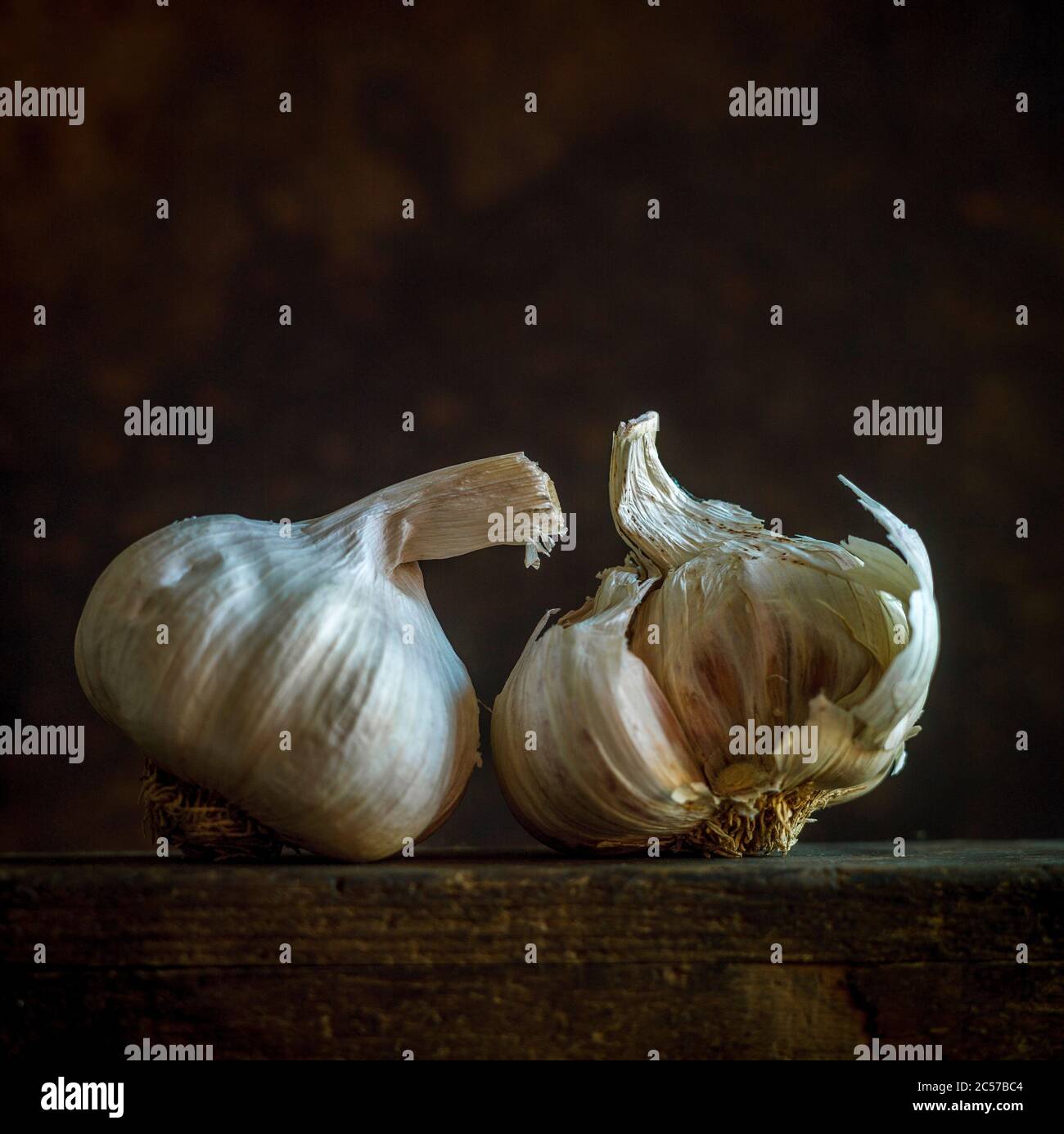 Closeup shot of fresh garlic on a wooden table Stock Photo