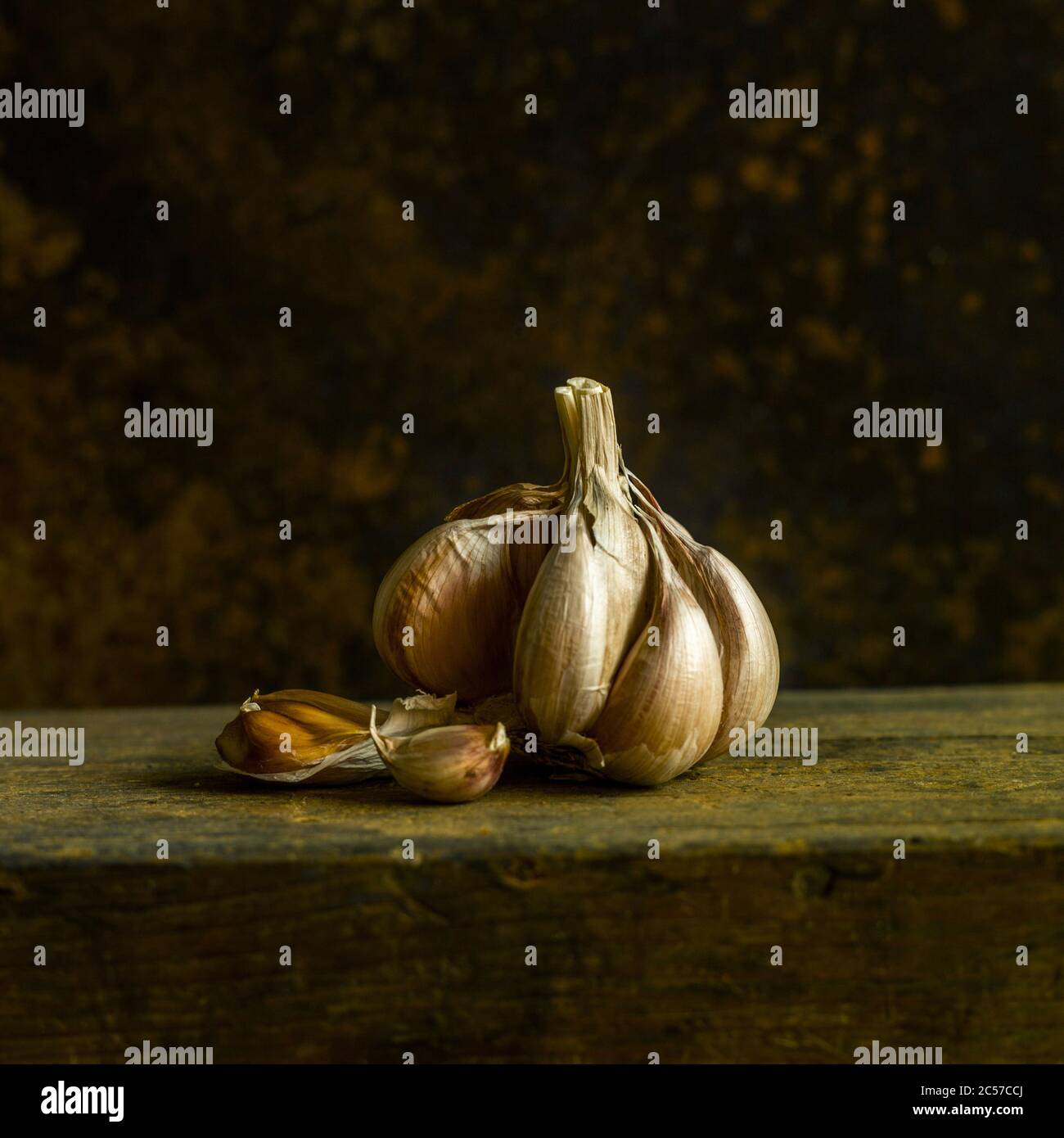 Closeup shot of garlic on the wooden table Stock Photo