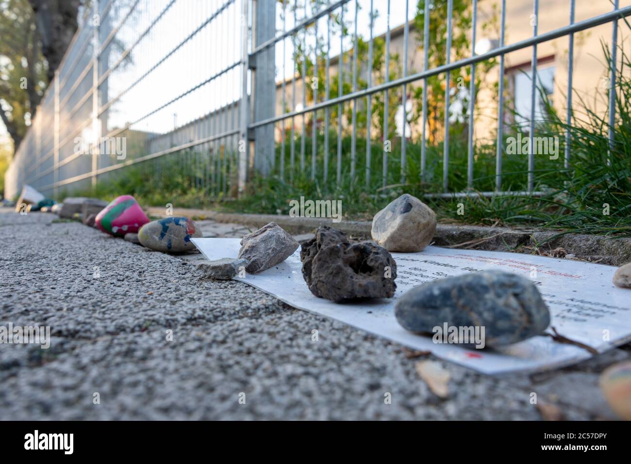 Germany, Saxony-Anhalt, Magdeburg: Colorful stones lie in front of the Pinocchio daycare center. They symbolize hope and joy in difficult times. Such Stock Photo
