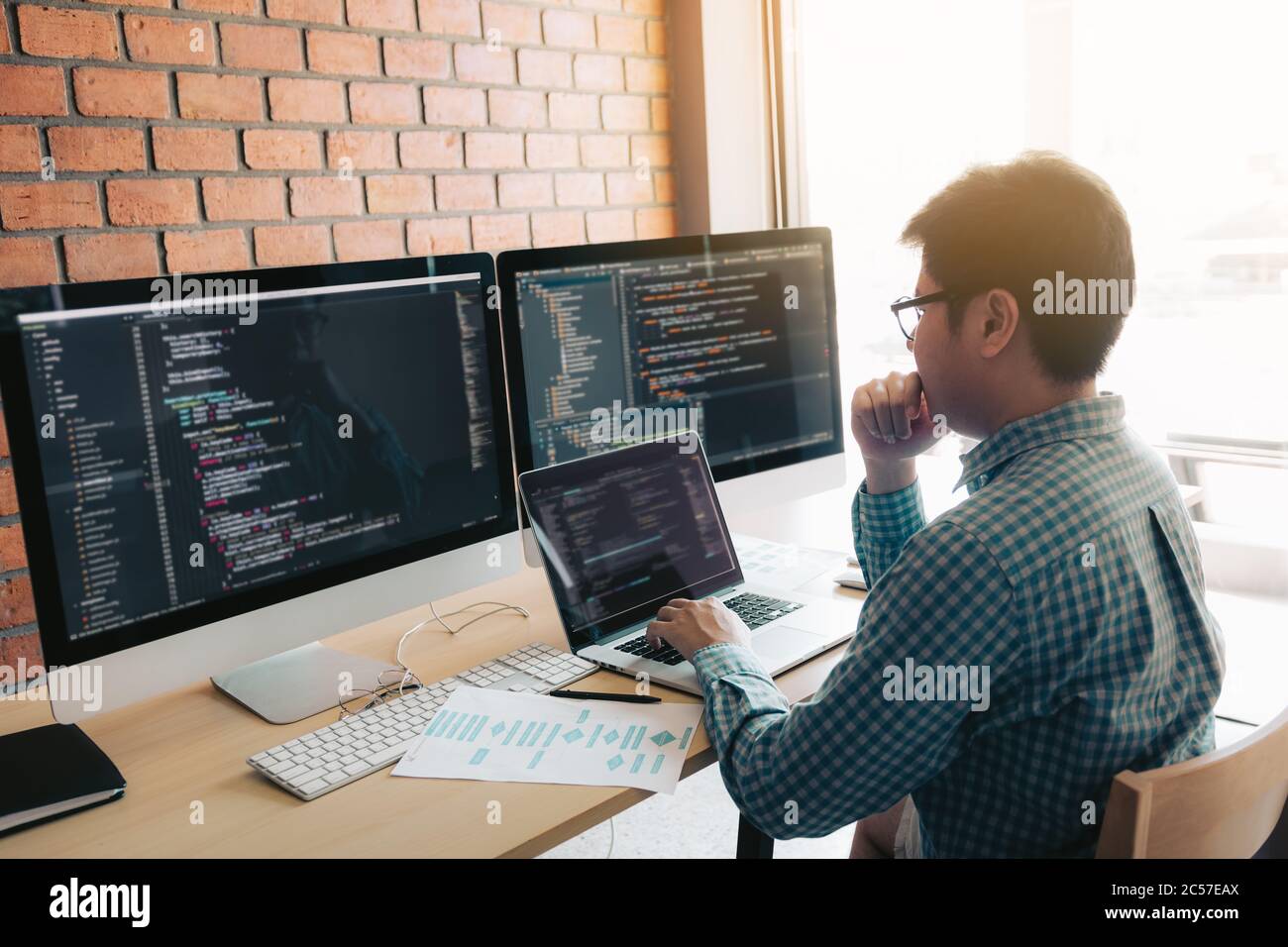 Developing programming and coding technology working in a software develop company office. Stock Photo