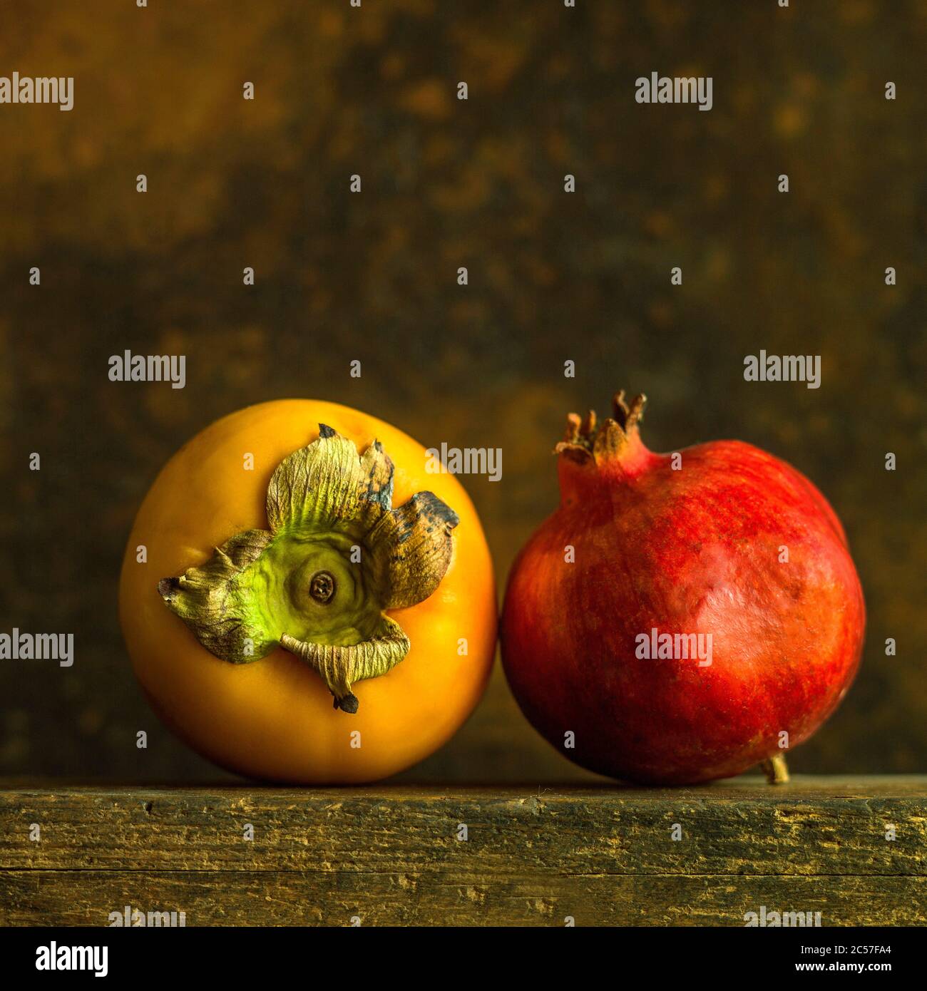 Close-up of persimmons and pomegranate Stock Photo
