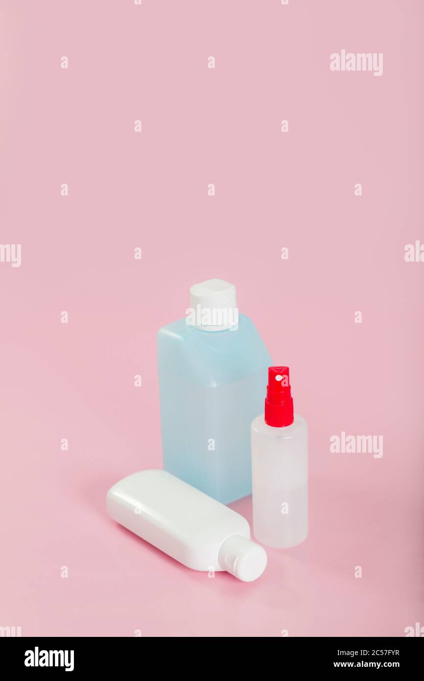 Disinfectant, bottles, three, standing, lying Stock Photo Alamy