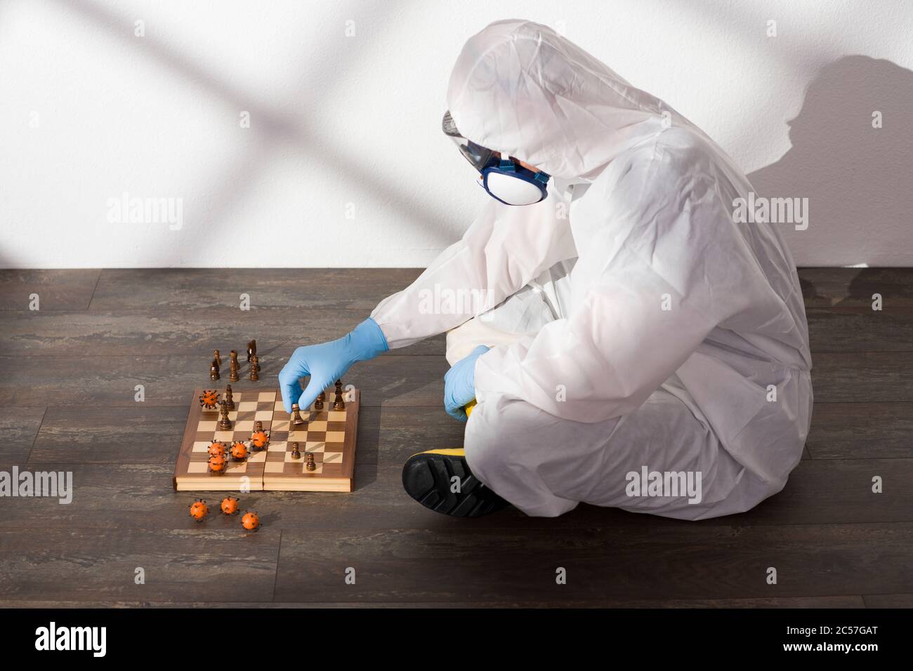 COVID-19, protective suit, chess, virus, strategy Stock Photo
