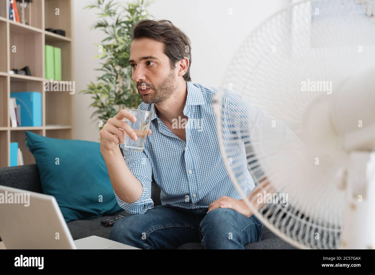 One man portrait trying to refresh during hot summer Stock Photo