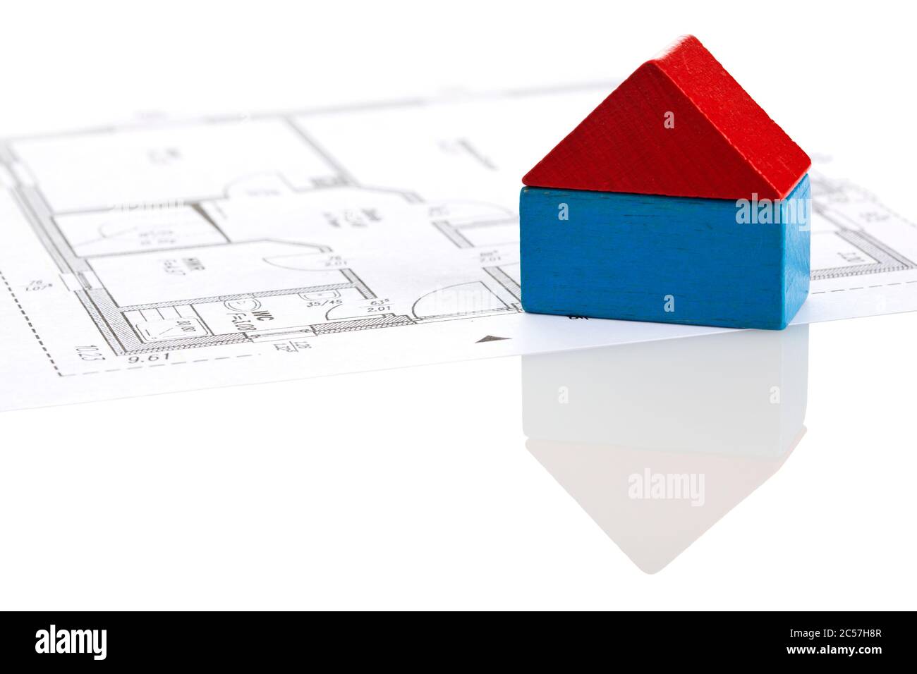 house made of two toy blocks on blueprint of floor plan Stock Photo
