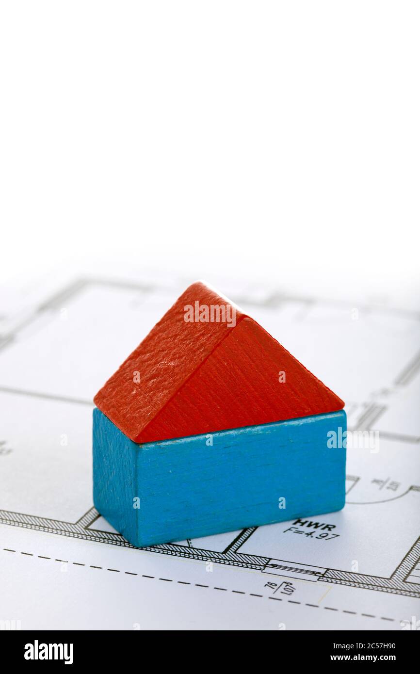 house made of two toy blocks on blueprint of floor plan Stock Photo