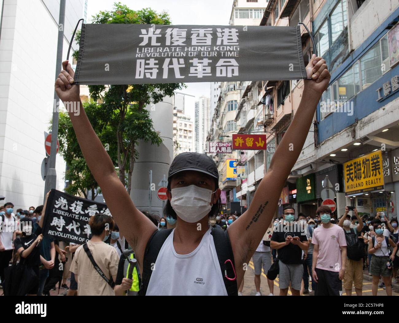 Hong Kong, Hong Kong, China. 1st July, 2020. A protester faces arrest for holding and anti Beijing sign.Hong Kong Special Administrative Region Establishment Day. Twenty-three years after Hong Kong was handed by Britain back to Chinese rule, Beijing is pushing to implement tough new national security laws that will suppress the pro-democracy protests seen in the city.It will shatter the Sino-British Joint Declaration where China agreed to the One country, Two systems government.The banning of traditional marches for the first time, has infuriated the public. (Credit Image: © Jayne Russell/ZUM Stock Photo