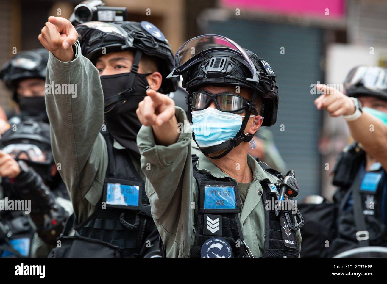 Hong Kong, Hong Kong, China. 1st July, 2020. Police point out people to arrest for Chanting slogans which is now illegal.Hong Kong Special Administrative Region Establishment Day. Twenty-three years after Hong Kong was handed by Britain back to Chinese rule, Beijing is pushing to implement tough new national security laws that will suppress the pro-democracy protests seen in the city.It will shatter the Sino-British Joint Declaration where China agreed to the One country, Two systems government.The banning of traditional marches for the first time, has infuriated the public. (Credit Image: © Stock Photo