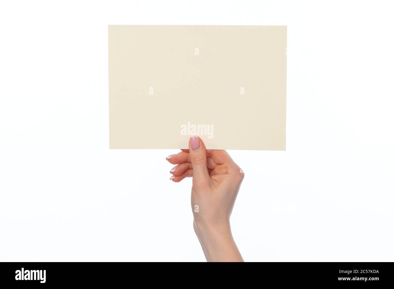 Female hand holding blank white sheet of paper isolated on white Stock ...