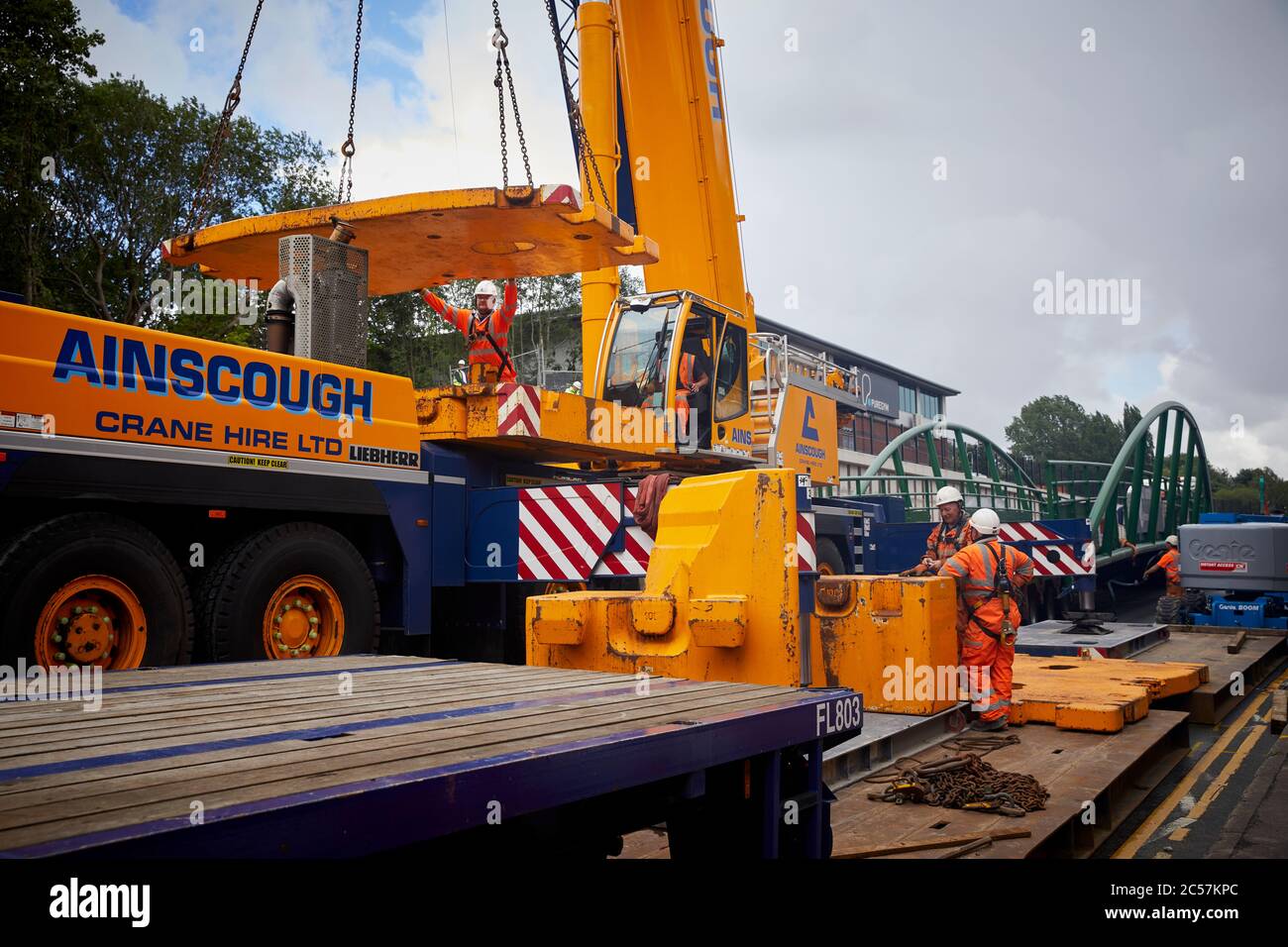 A57 Hyde Road in Gorton has a new footbridge Ainscough crane adds balance weights to itself Stock Photo