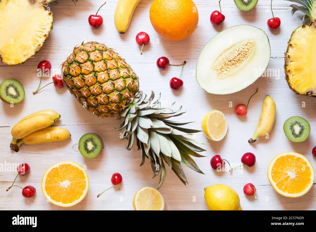 Tropical fruit on white wooden background Stock Photo